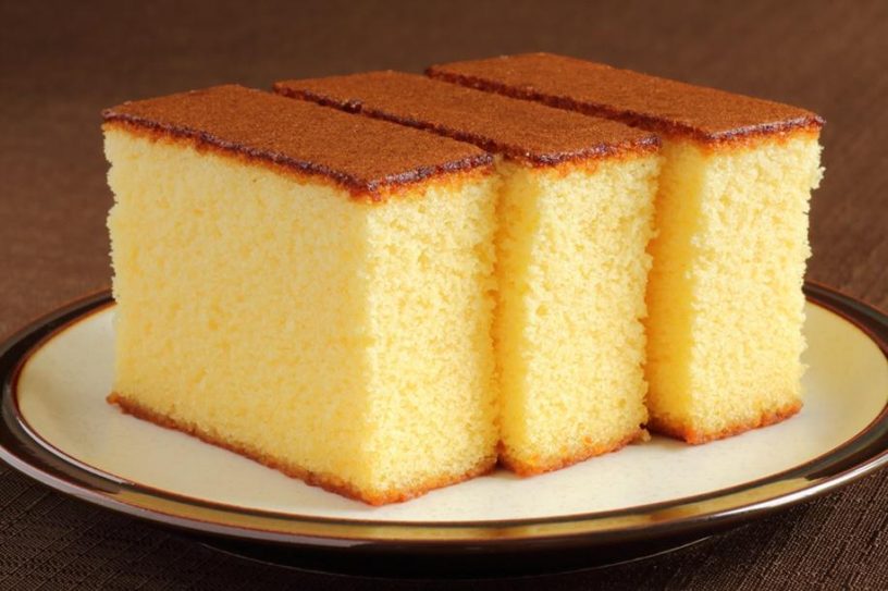 Slices Of Butter Cake On White Plate. Homemade Butter Cake With Dried  Cranberries So Delicious Soft And Moist. Tasty Pound Cake Or Butter Cake  Served On Wood Table. Homemade Bakery Background Concept.