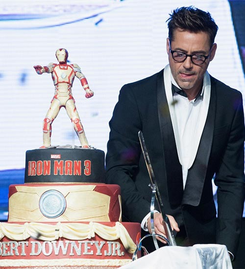 Robert Downey Junior cutting his 48th Birthday Cake