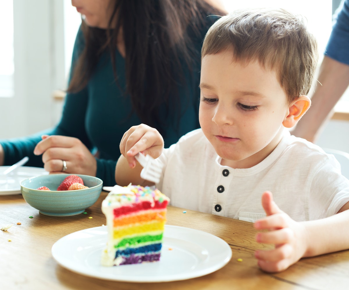 a kid while eating cake