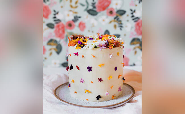 cake with edible flowers on top