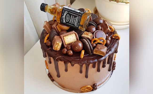 Chocolate Cake With Alcohol Bottle Edible Decoration On Top