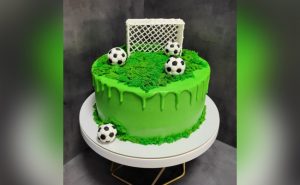 Soccer Themed Cake In Green Frosting & Edible Soccer Balls
